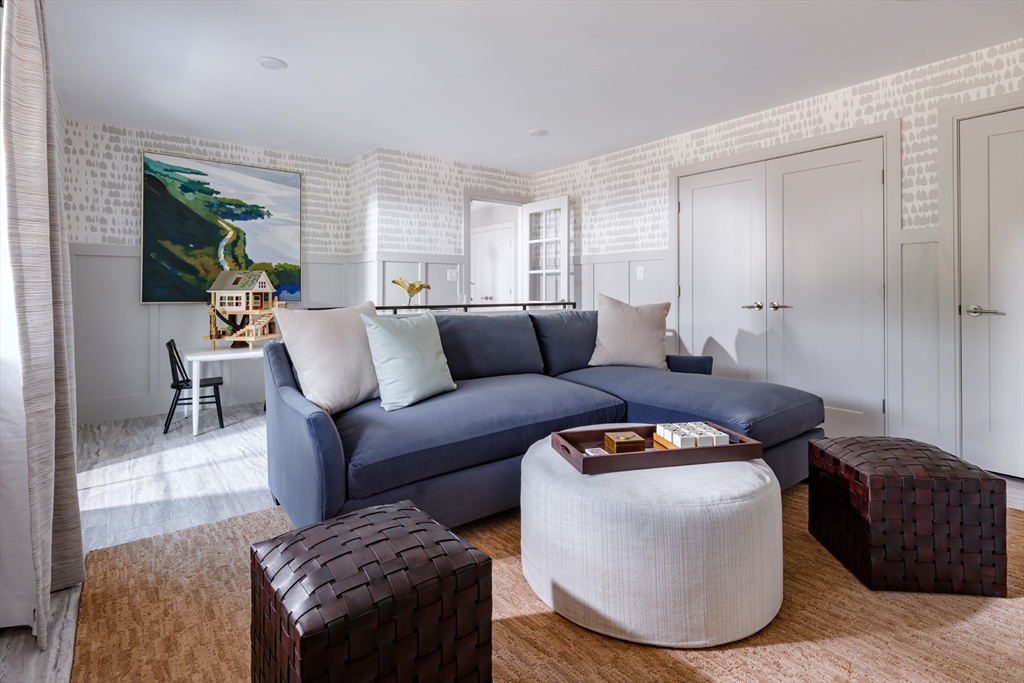 643 Church Street, Unit 122 Raynham, MA 02767 - Photo 13 of 28 a living room with furniture and a rug