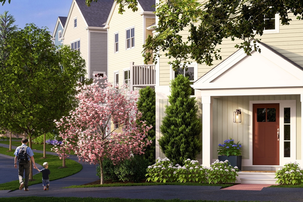 643 Church Street, Unit 122 Raynham, MA 02767 - Photo 19 of 28 a front view of a house with a garden