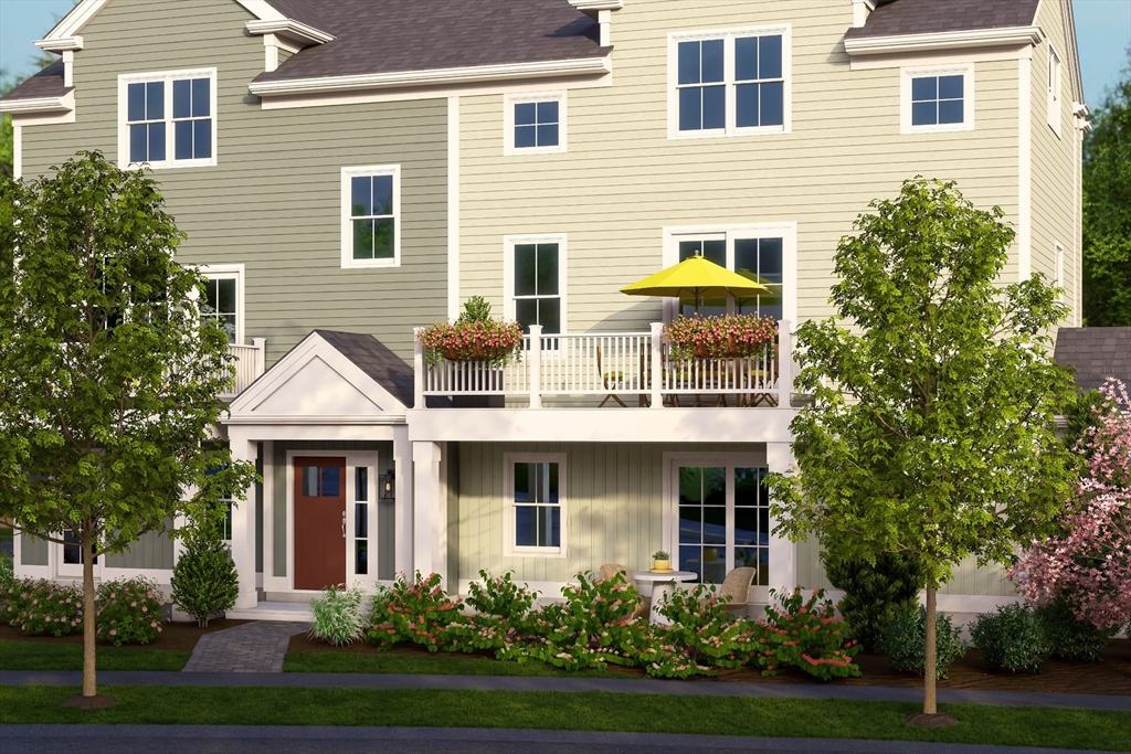 643 Church Street, Unit 122 Raynham, MA 02767 - Photo 25 of 28 a front view of a house with garden and trees