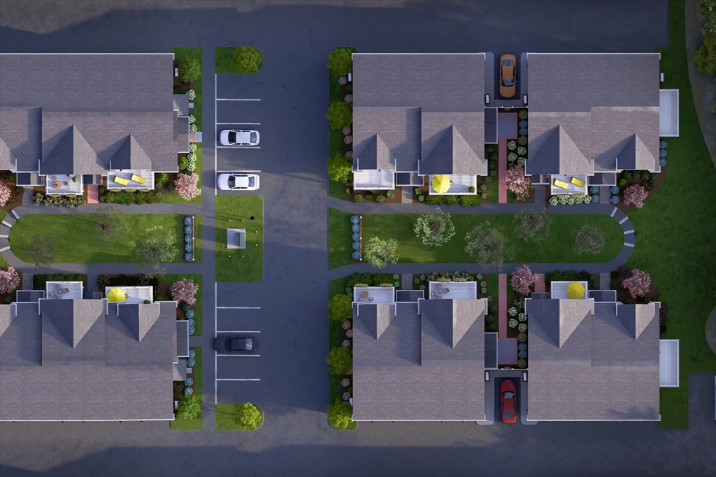 643 Church Street, Unit 122 Raynham, MA 02767 - Photo 27 of 28 an aerial view of multiple houses with a yard