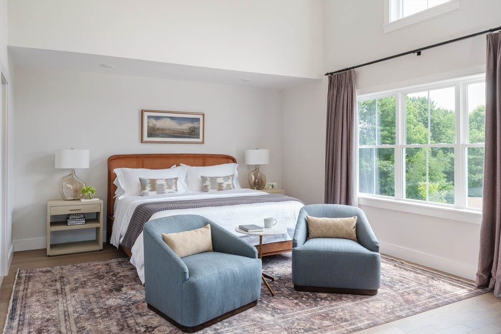 643 Church Street, Unit 122 Raynham, MA 02767 - Photo 8 of 28 a bedroom with furniture and a window