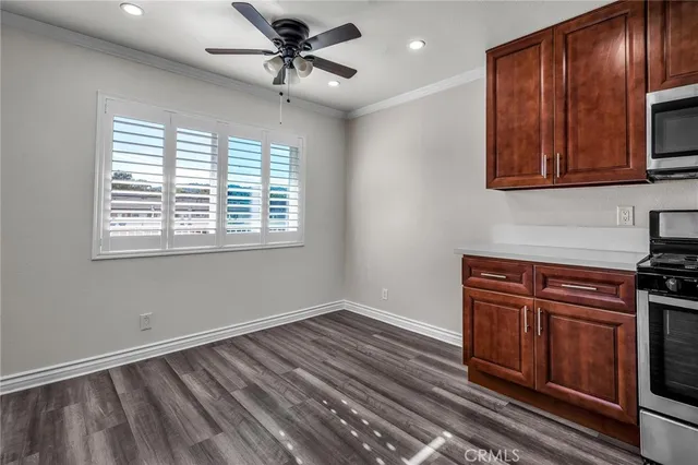 a view of a kitchen with a sink and cabinets