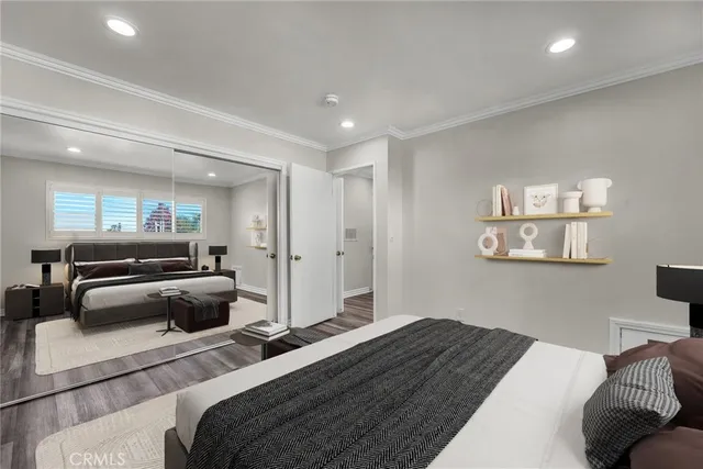 a bedroom with a bed and a couch