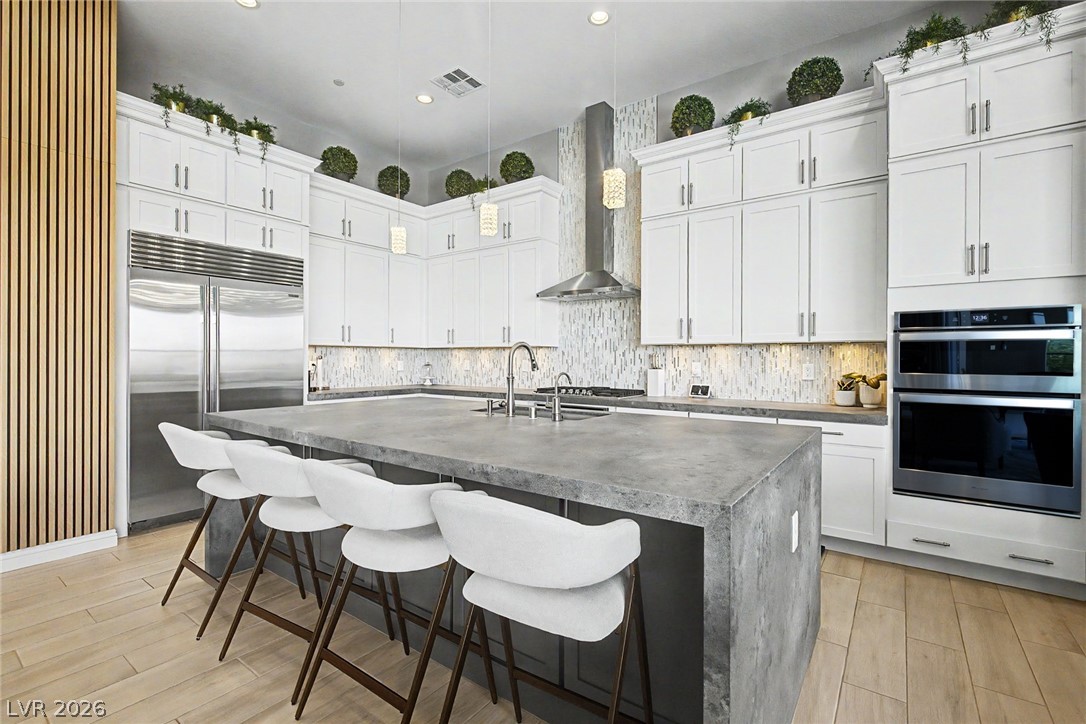 6014 Willow Ridge Court Las Vegas, NV 89135 - Photo 30 of 99 This sleek kitchen features clean lines and contemporary finishes perfect for entertaining.