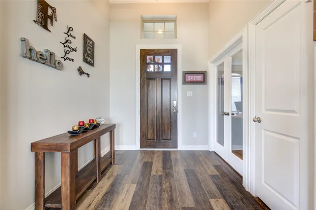 a view of an entryway with wooden floor