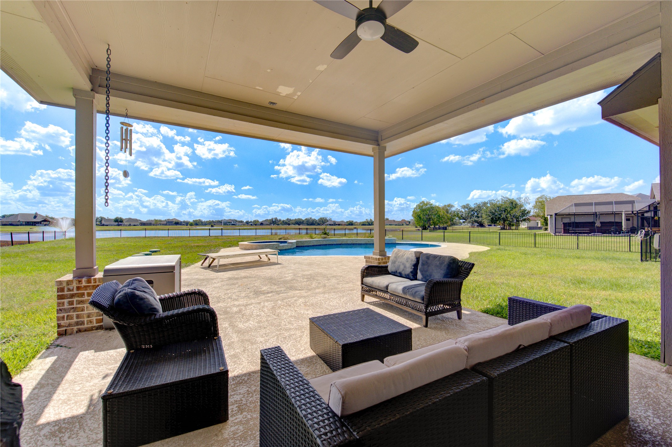 203 Lily Lane Rosharon, TX 77583 - Photo 37 of 50 a view of swimming pool with a table and chairs