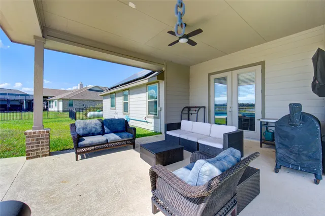 a living room with furniture and a yard