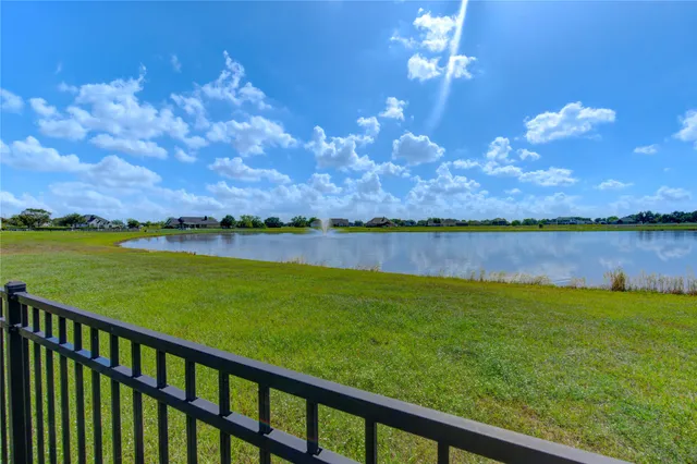 a view of a lake with a big yard