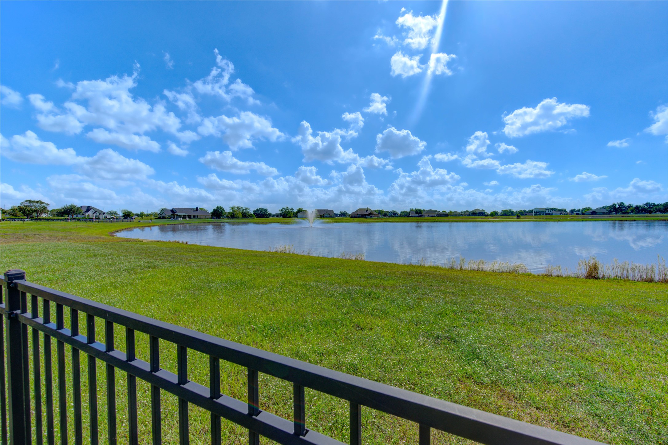 203 Lily Lane Rosharon, TX 77583 - Photo 42 of 50 a view of a lake with a big yard