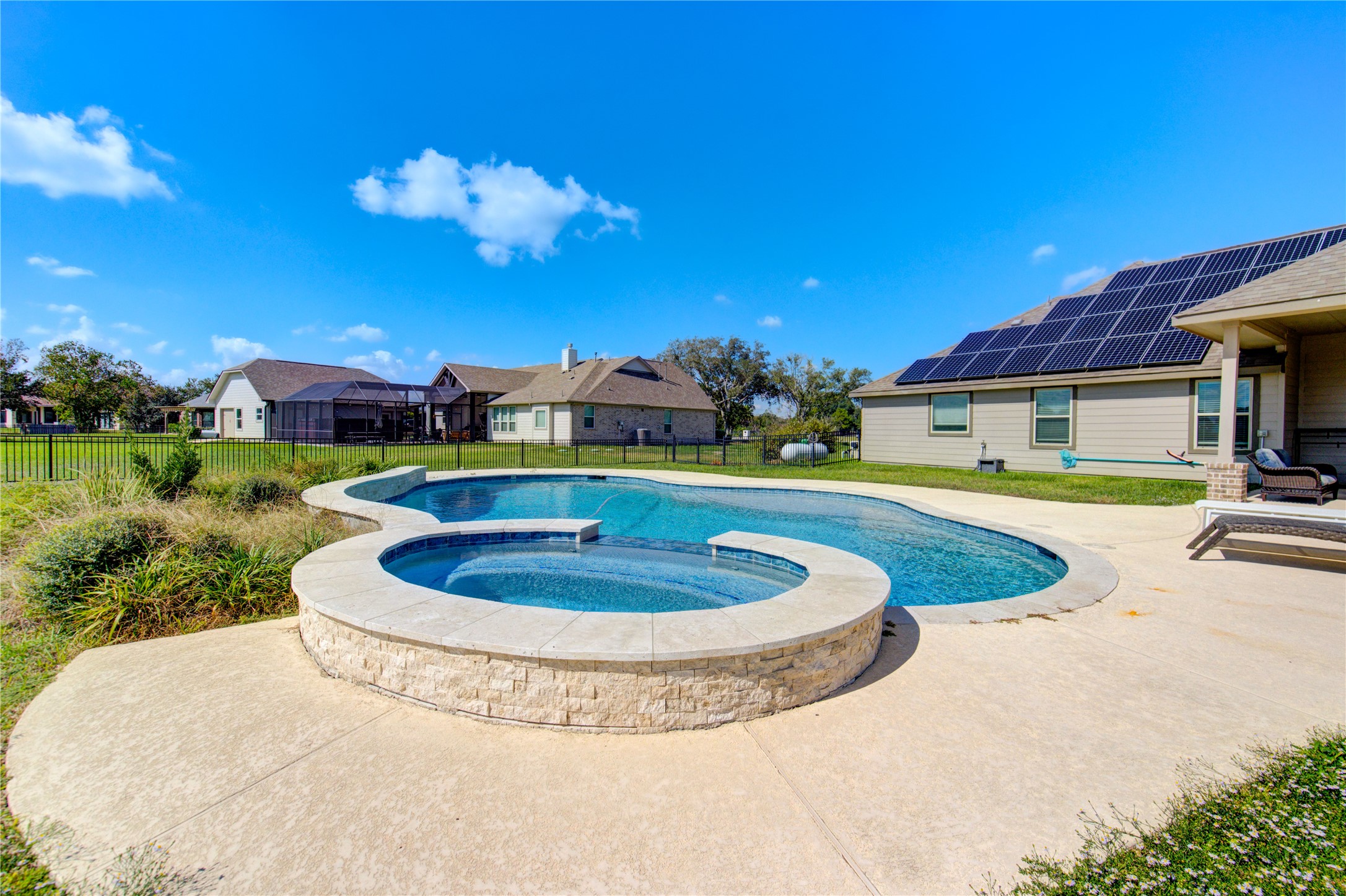 203 Lily Lane Rosharon, TX 77583 - Photo 44 of 50 a view of a swimming pool with a yard
