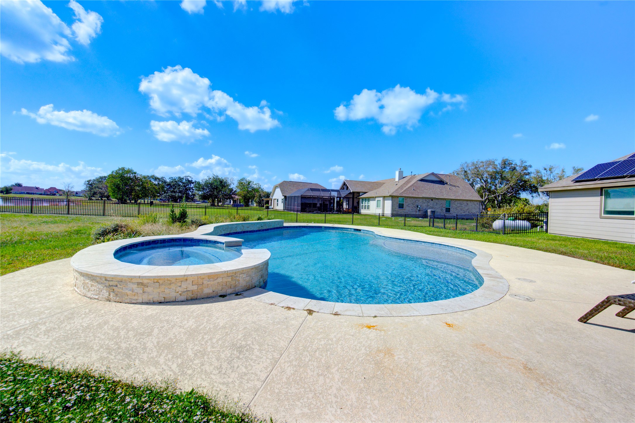 203 Lily Lane Rosharon, TX 77583 - Photo 45 of 50 a view of a swimming pool with a yard and a fountain