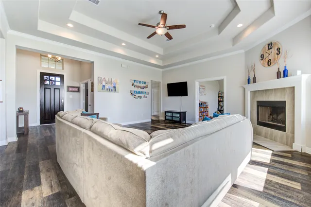 a living room with furniture and a fireplace