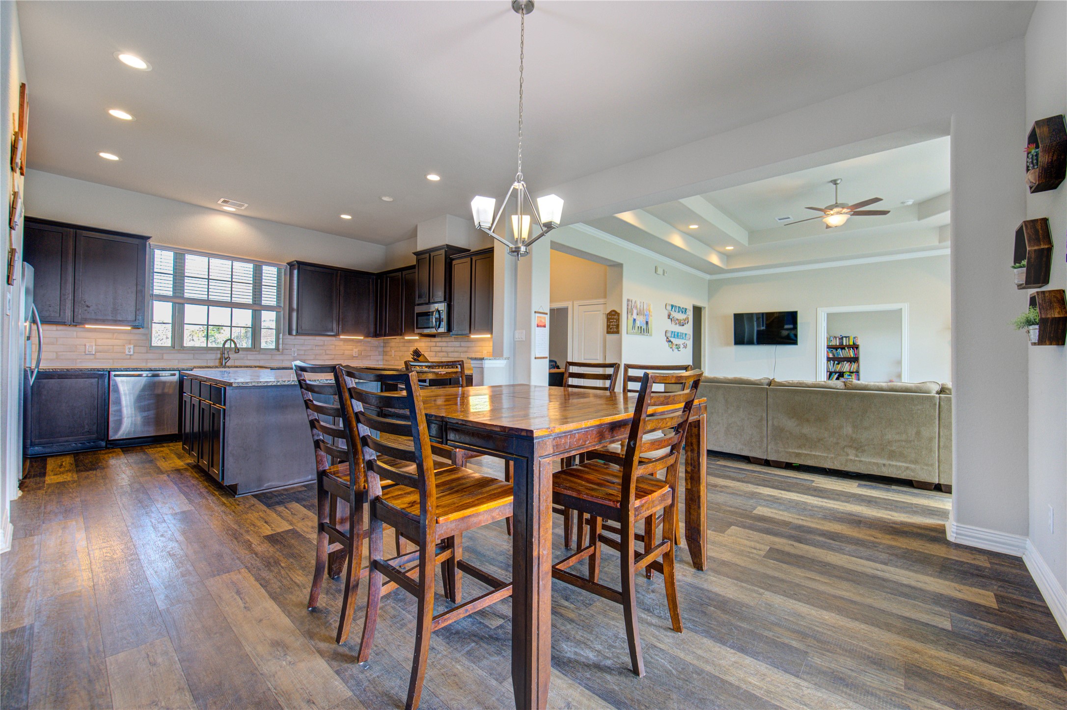 203 Lily Lane Rosharon, TX 77583 - Photo 9 of 50 a view of a dining area with furniture and wooden floor