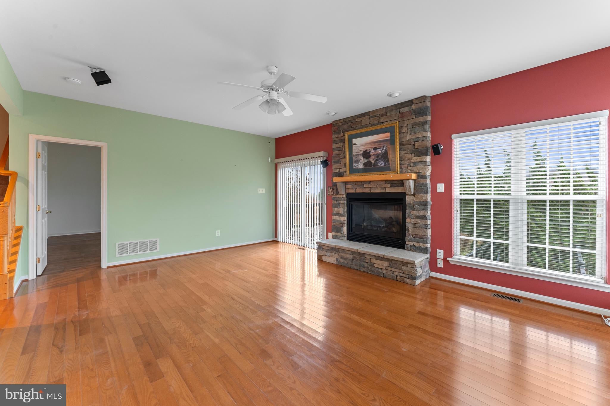 361 Pierce Run Newark, DE 19702 - Photo 16 of 32 a view of an empty room with glass door and wooden floor