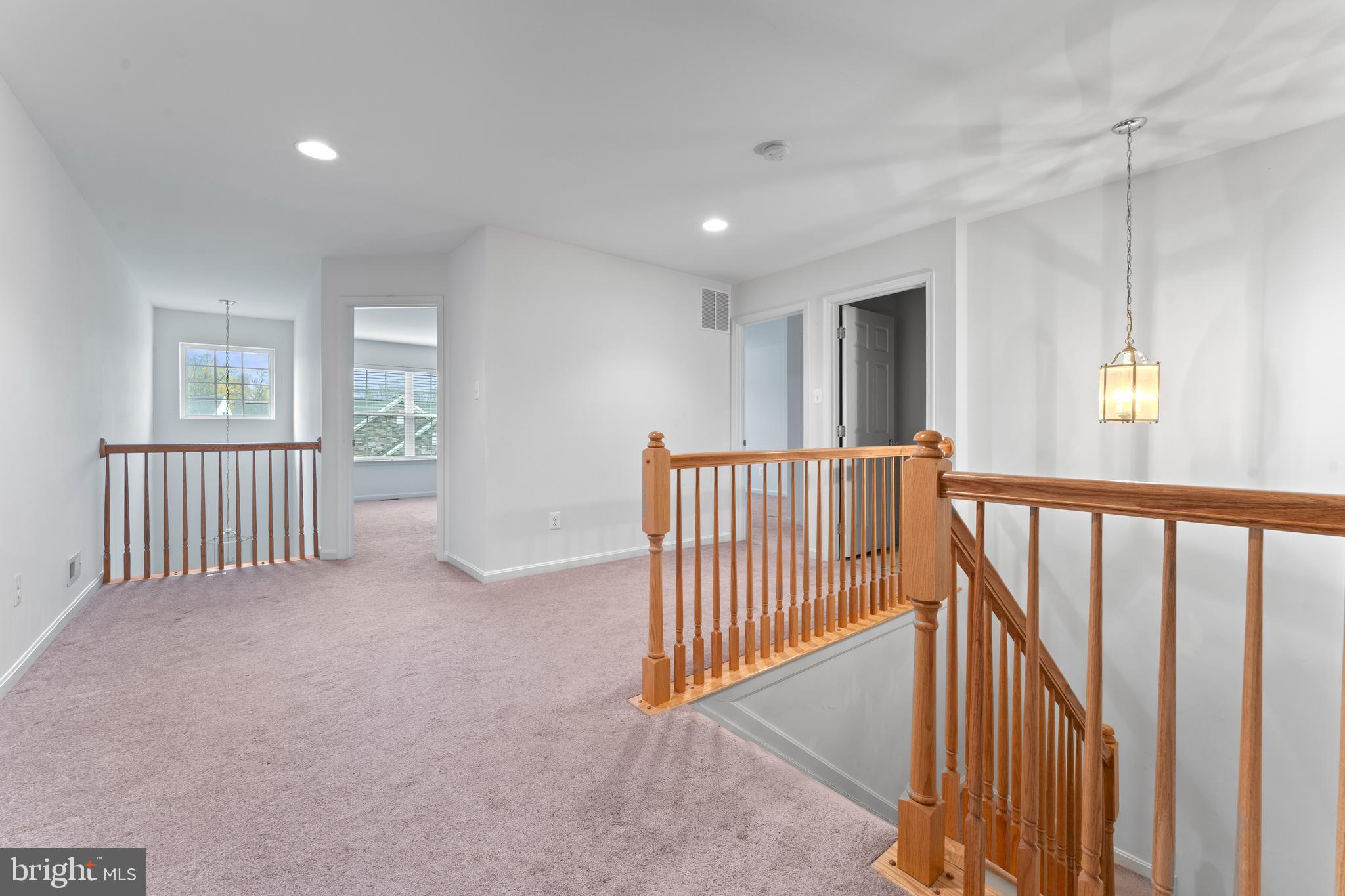 361 Pierce Run Newark, DE 19702 - Photo 21 of 32 a view of a hallway with windows and stairs