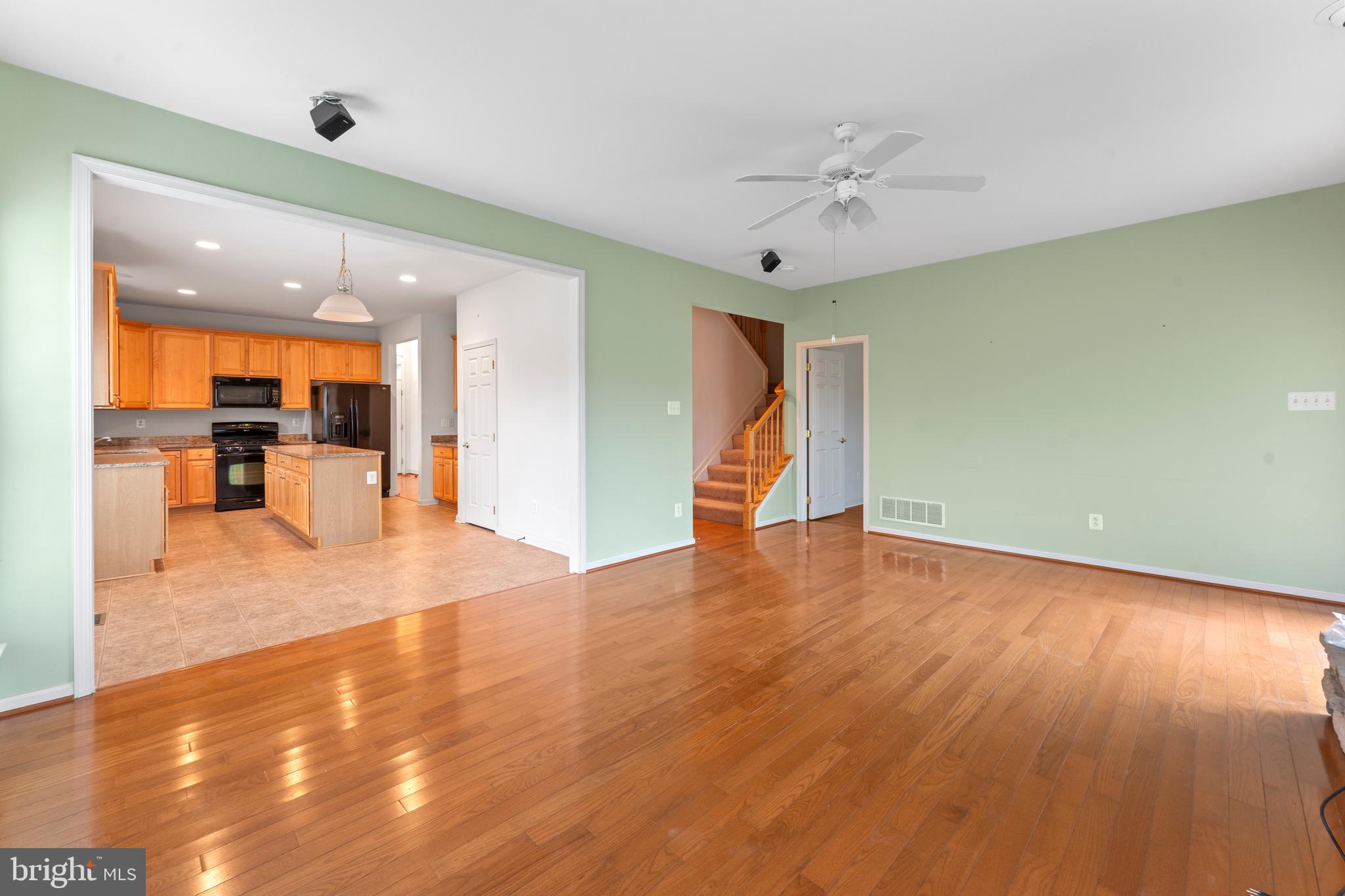 361 Pierce Run Newark, DE 19702 - Photo 10 of 32 a view of a livingroom with a furniture wooden floor and a ceiling fan
