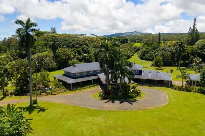 4591 Kuawa Road Kilauea, HI 96754 - Photo 23 of 30 a view of a swimming pool with a yard and mountain in the back