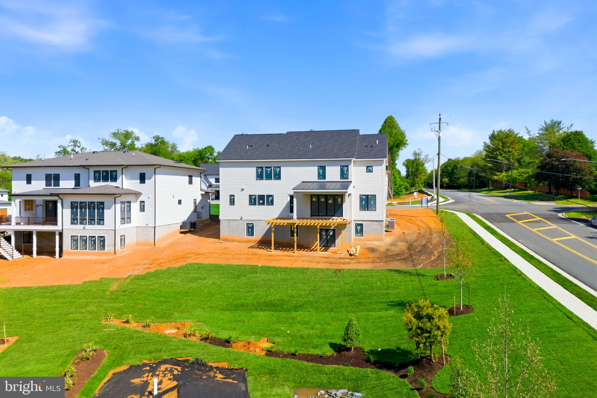 10801 Mason Hunt Court Reston, VA 20190 - Photo 10 of 26 a front view of a house with patio and yard
