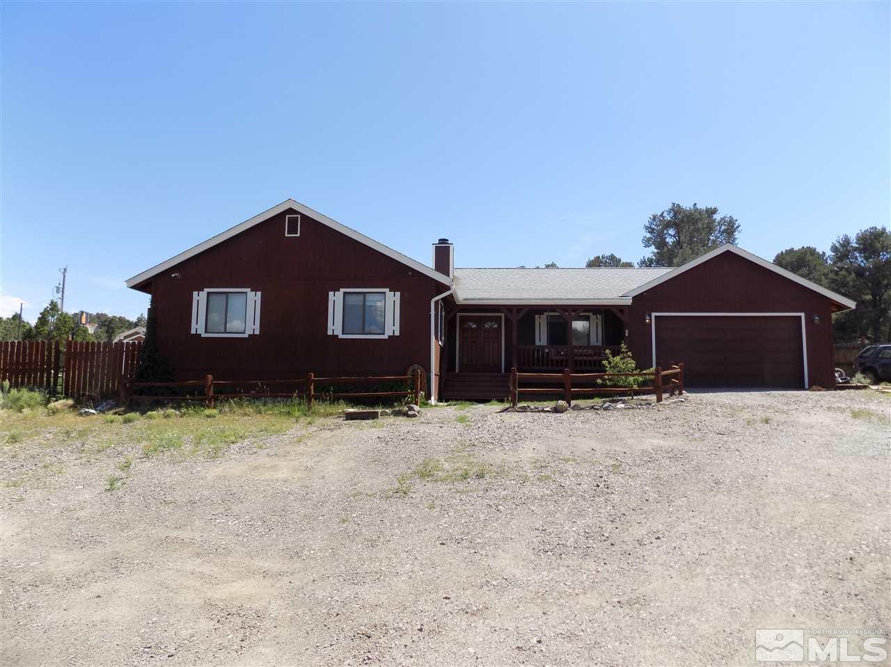 2469 Cartwright Road Reno, NV 89521 - Photo 1 of 24 a front view of a house with a yard and garage