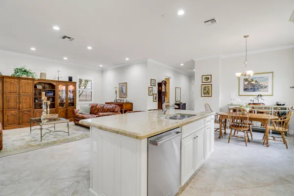 a large kitchen with lots of counter space and windows