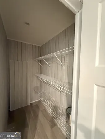 a view of a kitchen with a sink and a refrigerator