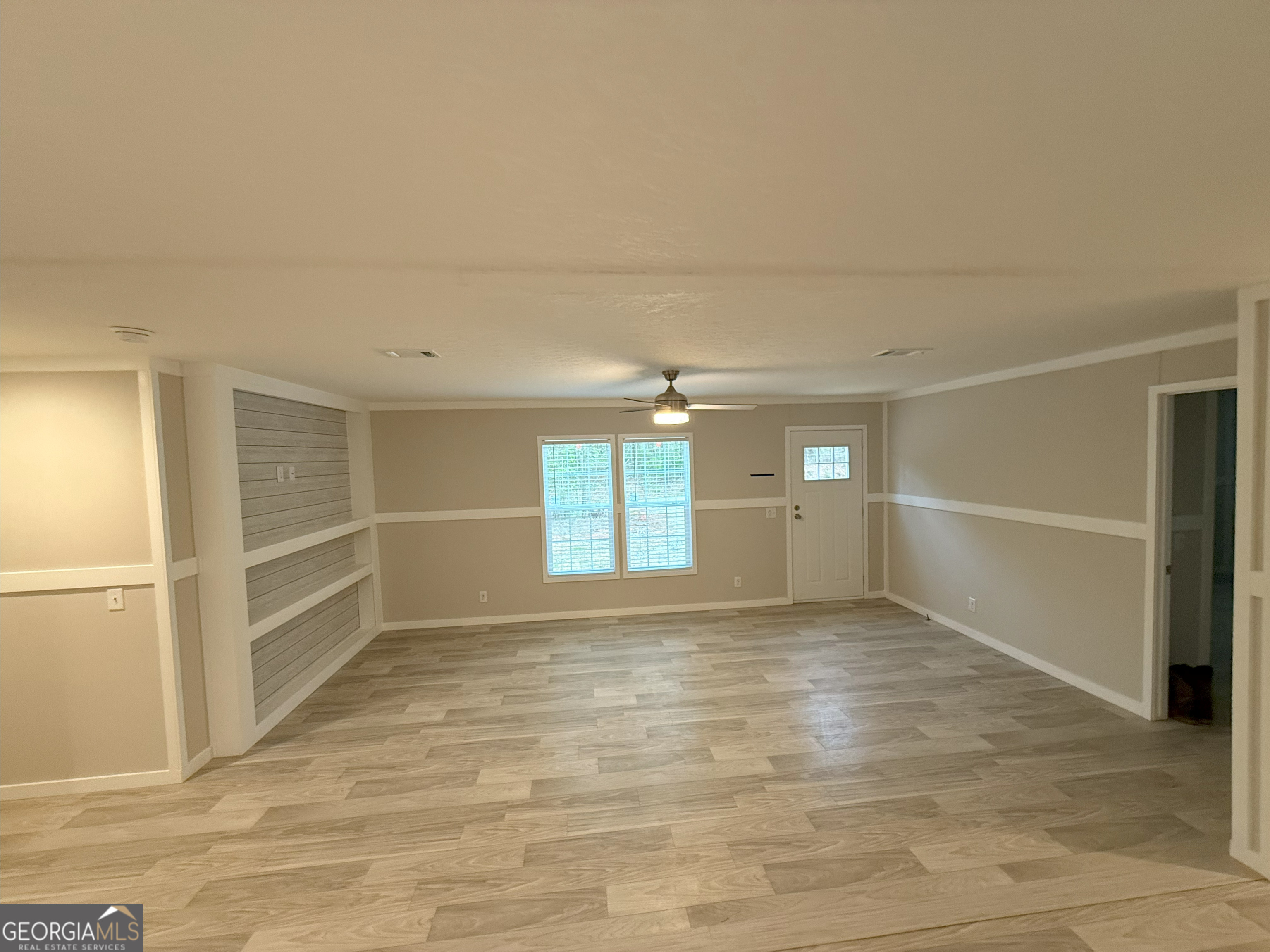 2126 Amberly Road Elberton, GA 30635 - Photo 17 of 68 an empty room with windows and cabinet