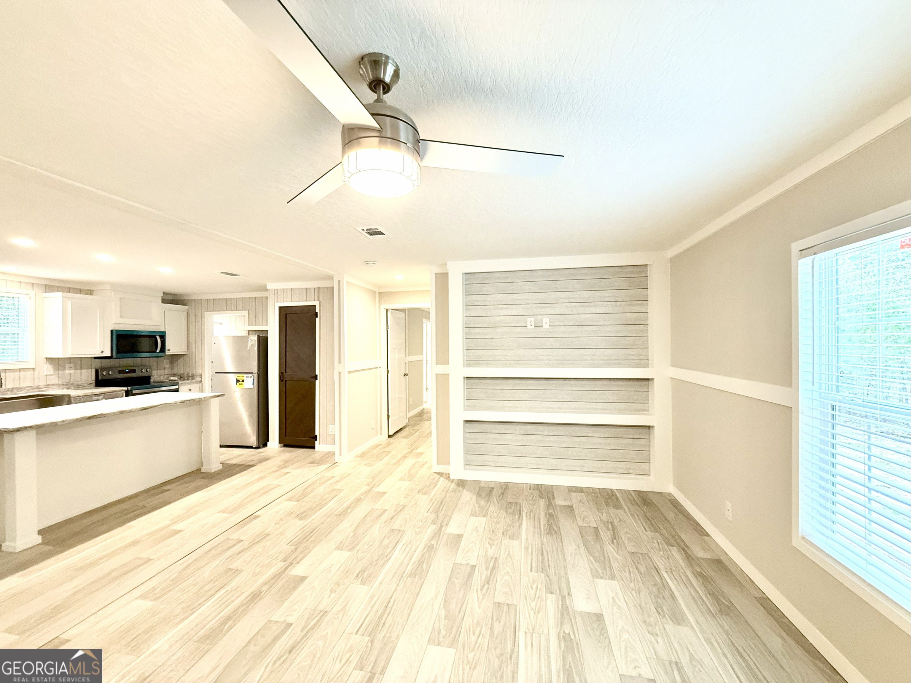 2126 Amberly Road Elberton, GA 30635 - Photo 22 of 68 a view of a kitchen with a sink and a refrigerator