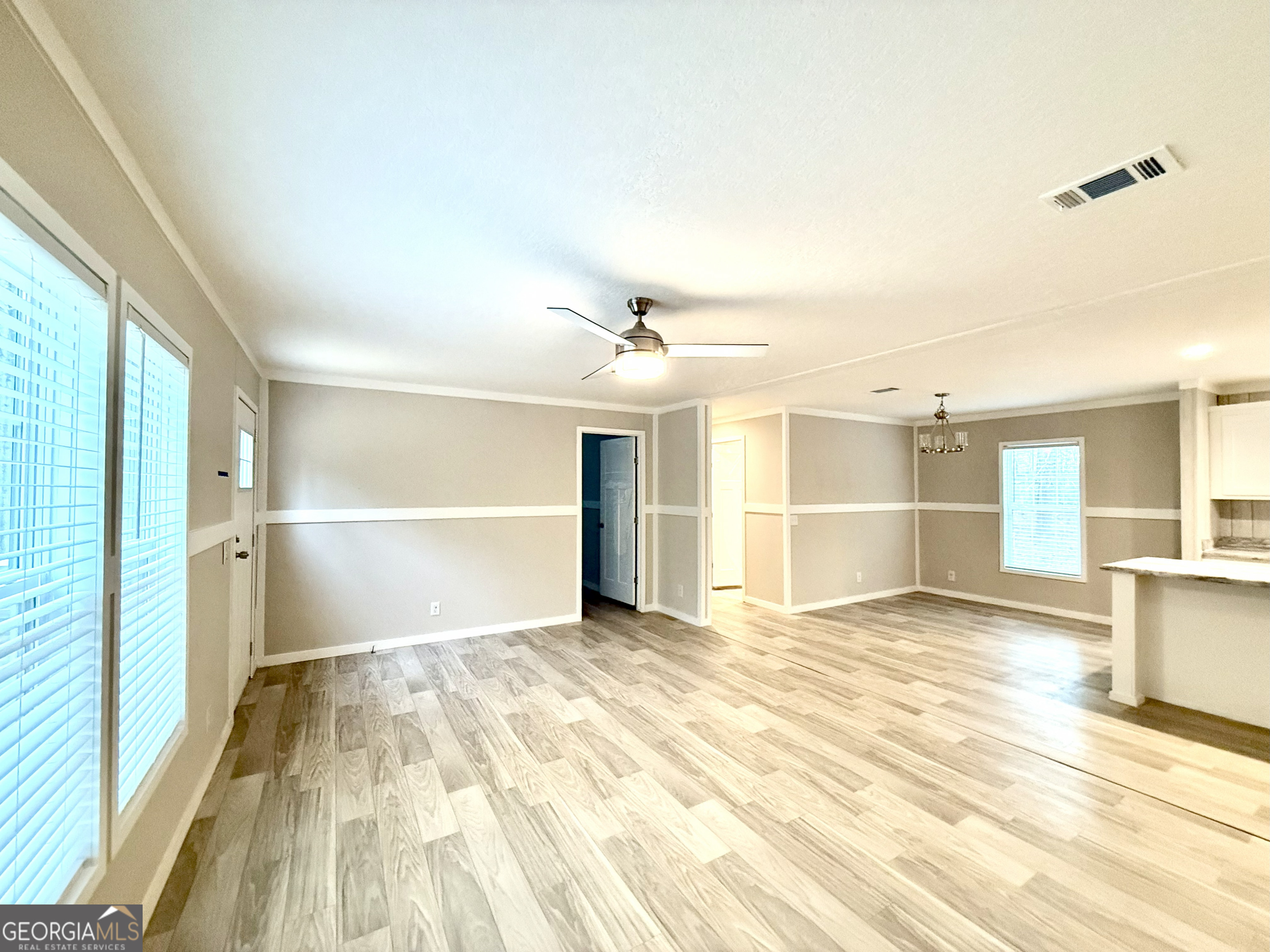 2126 Amberly Road Elberton, GA 30635 - Photo 24 of 68 a view of a room with wooden floor and white walls