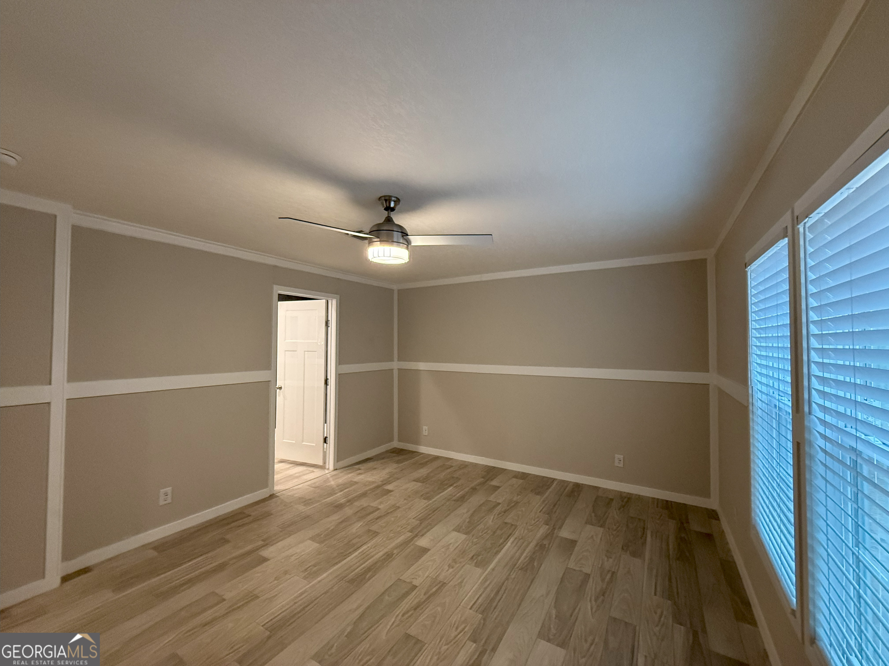 2126 Amberly Road Elberton, GA 30635 - Photo 26 of 68 an empty room with wooden floor and windows