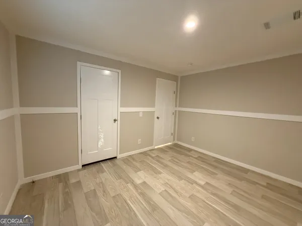a bathroom with a double vanity sink and mirror