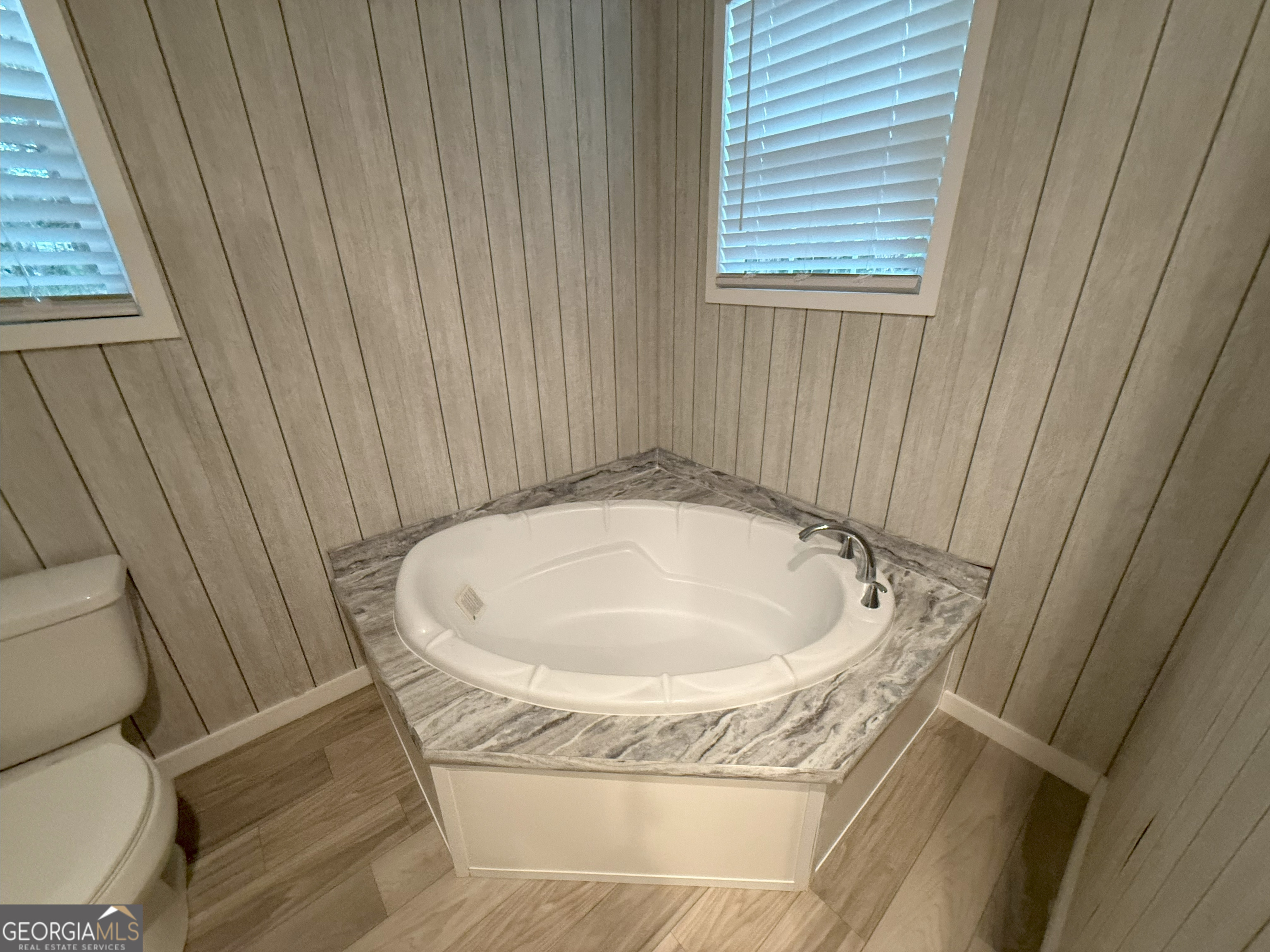 2126 Amberly Road Elberton, GA 30635 - Photo 38 of 68 a bath tub sitting in a bathroom