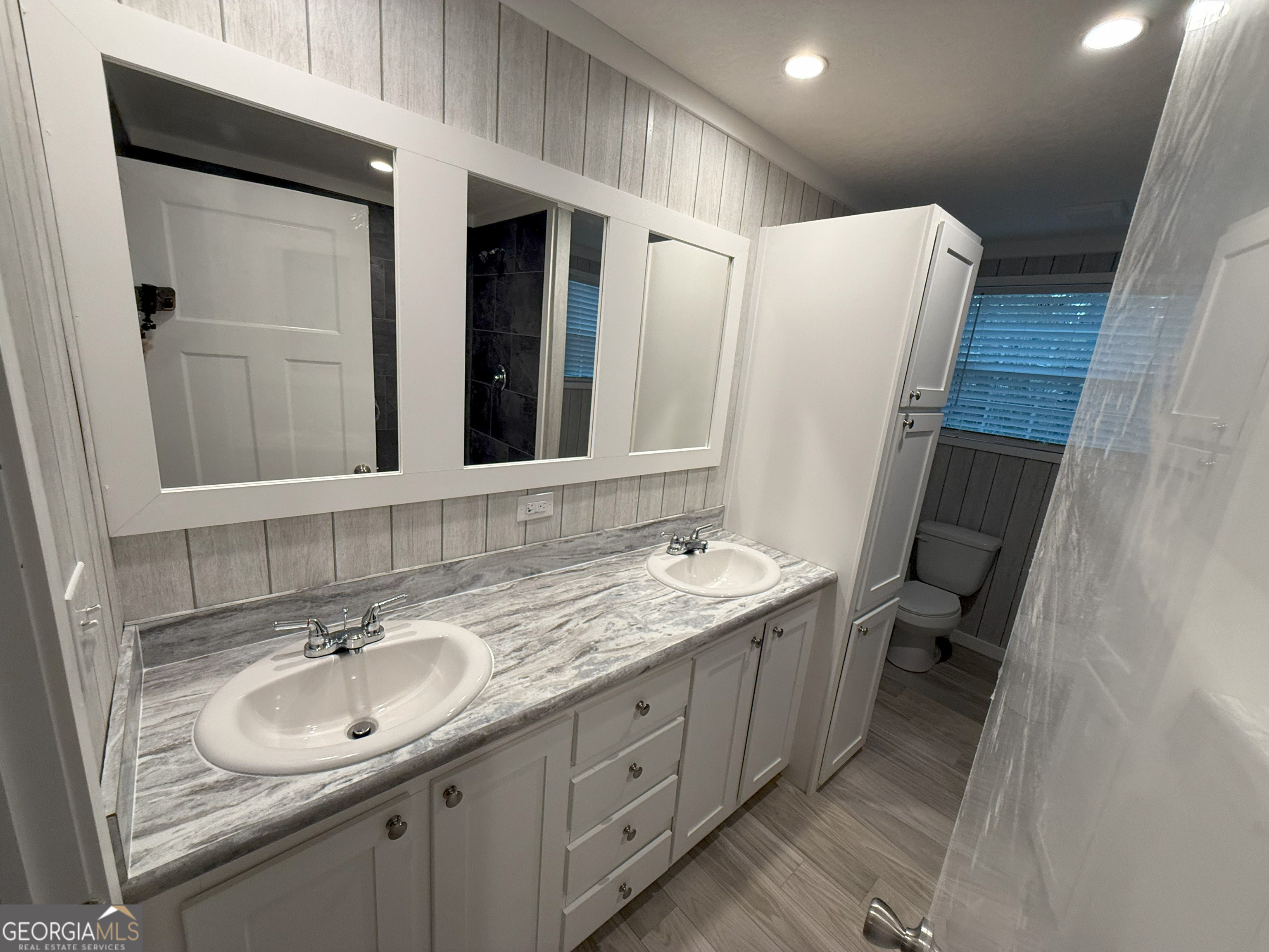 2126 Amberly Road Elberton, GA 30635 - Photo 39 of 68 a bathroom with a double vanity sink and mirror