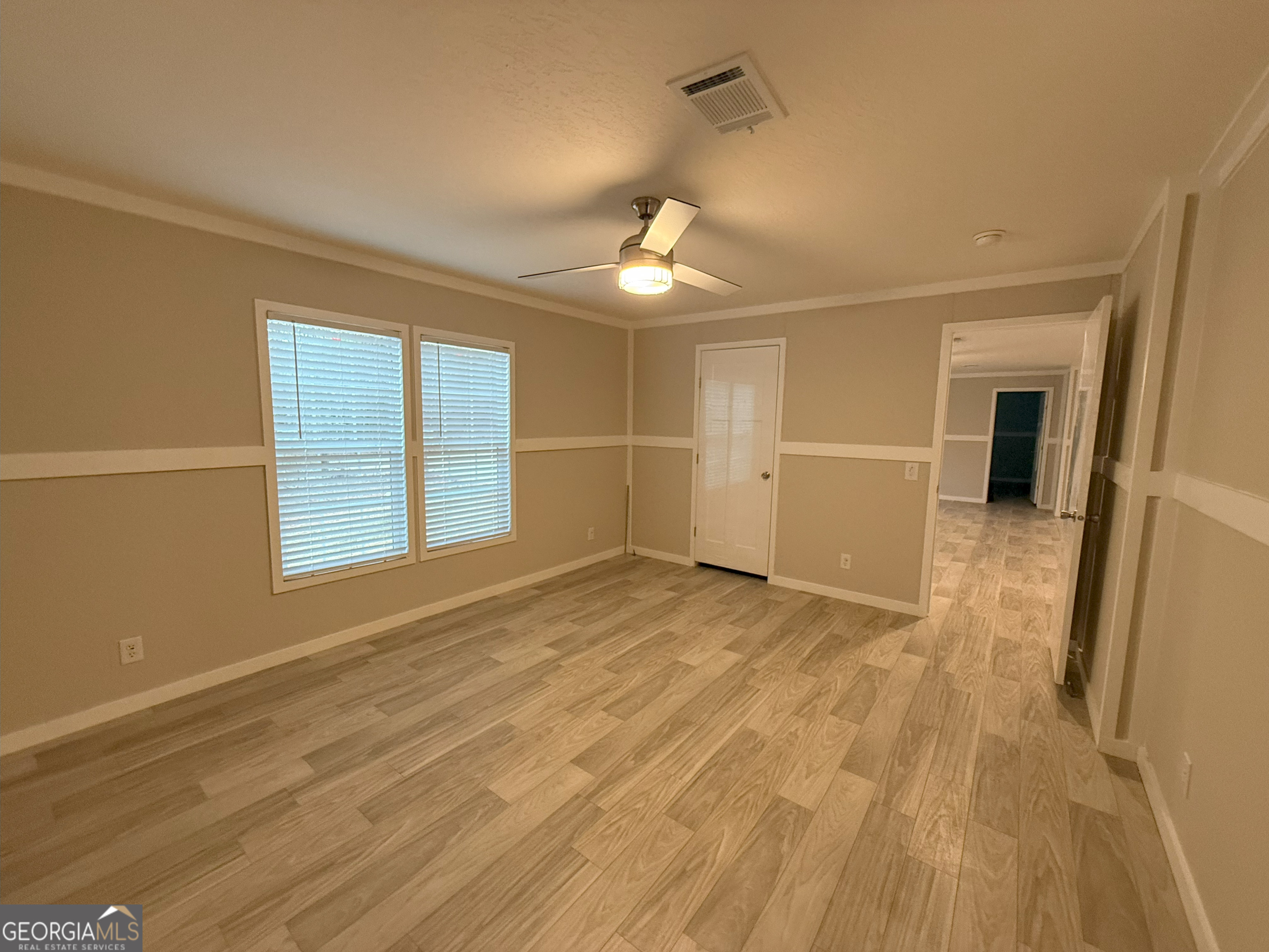 2126 Amberly Road Elberton, GA 30635 - Photo 42 of 68 a view of empty room with wooden floor and fan
