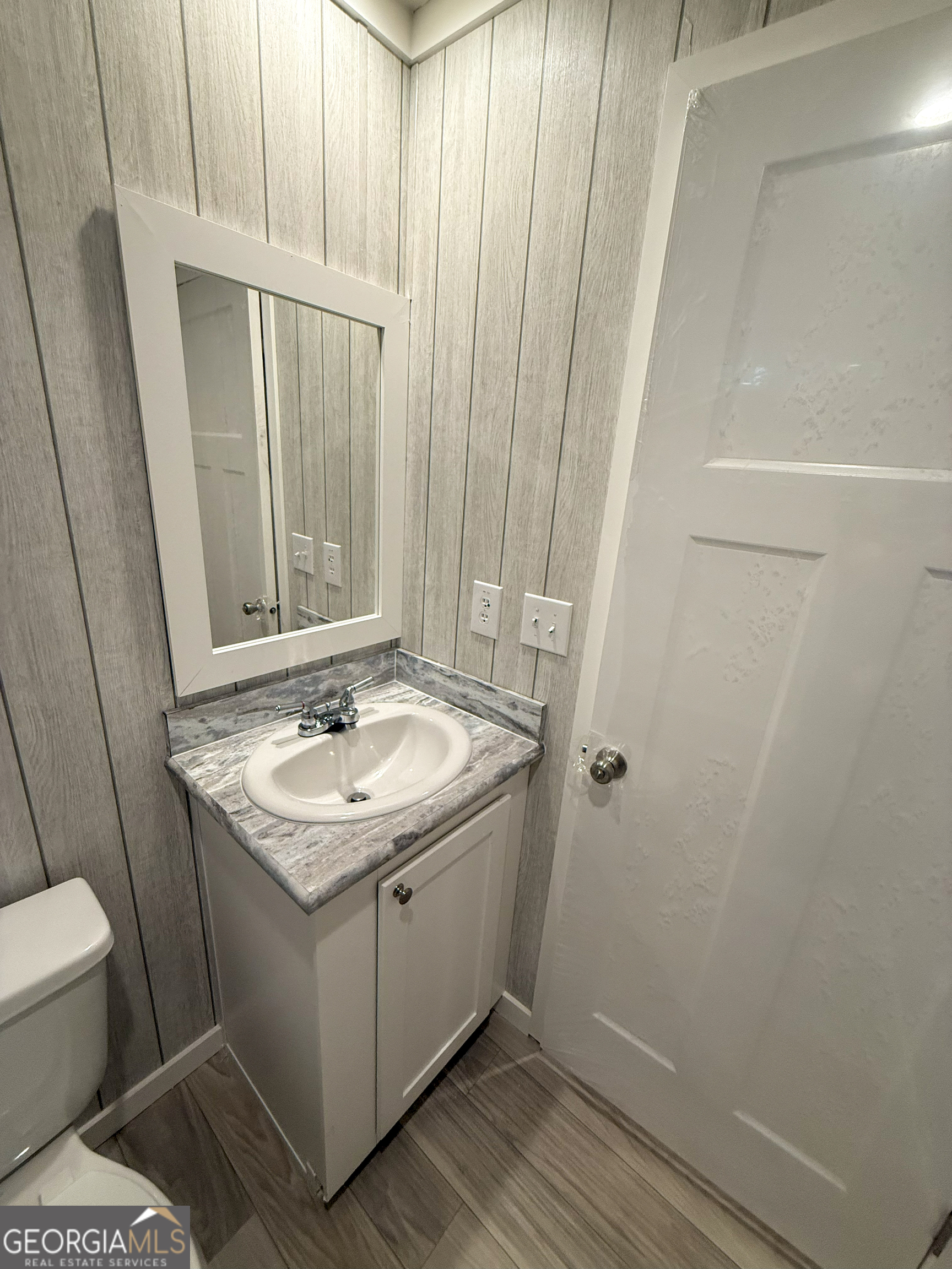 2126 Amberly Road Elberton, GA 30635 - Photo 47 of 68 a bathroom with a sink and a mirror