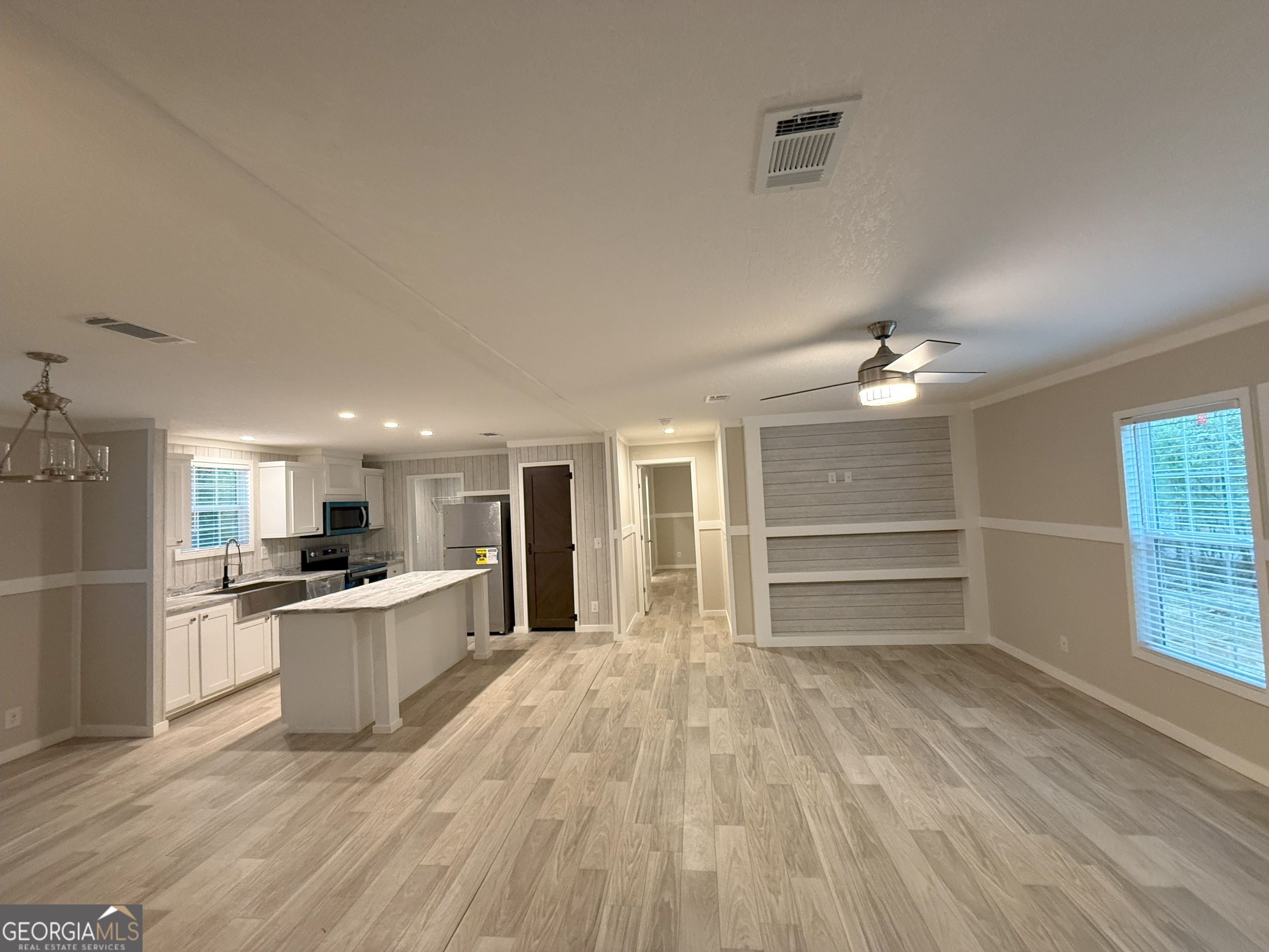 2126 Amberly Road Elberton, GA 30635 - Photo 51 of 68 a view of a kitchen with a sink stove and cabinets