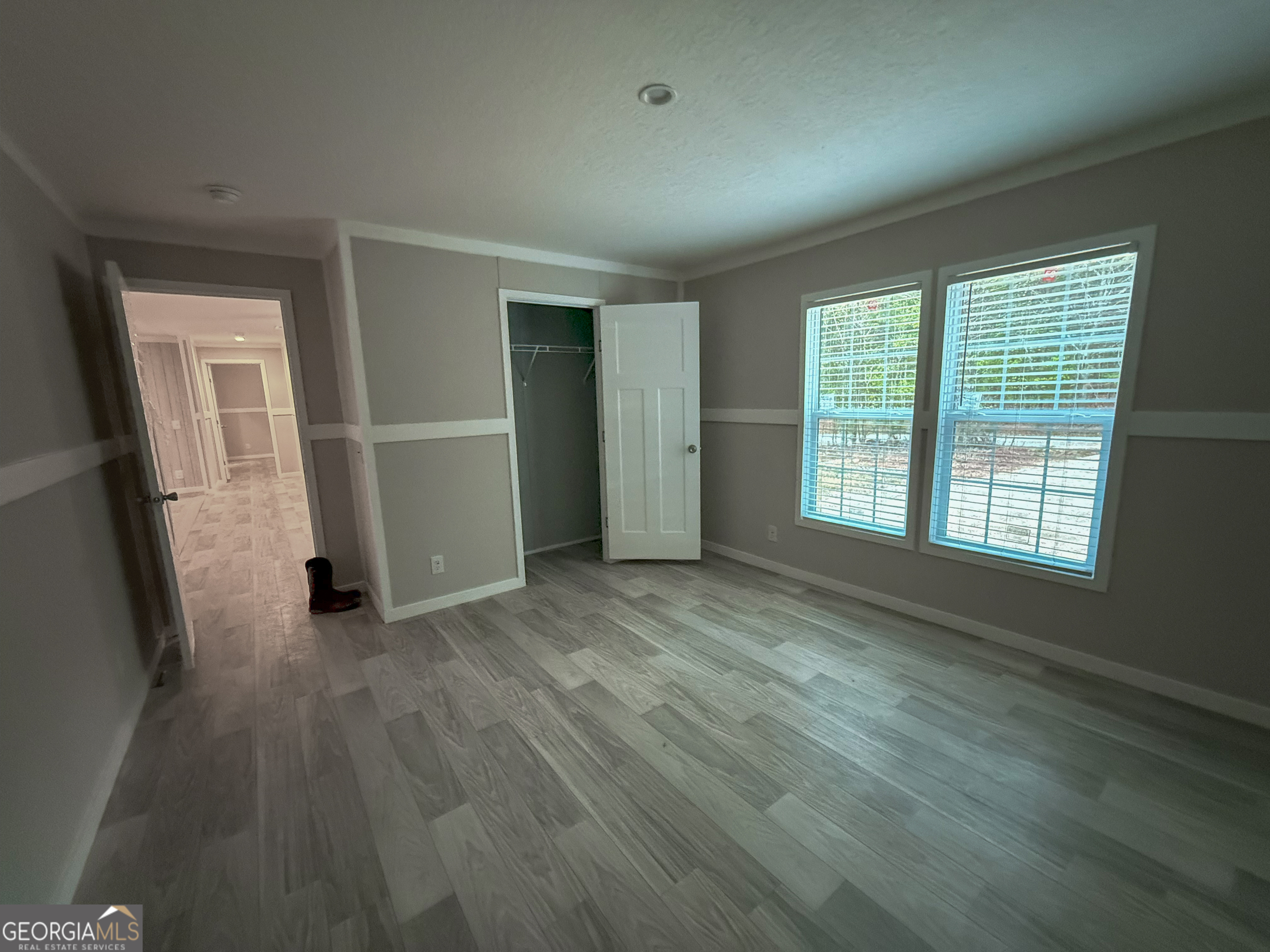 2126 Amberly Road Elberton, GA 30635 - Photo 53 of 68 an empty room with wooden floor and windows