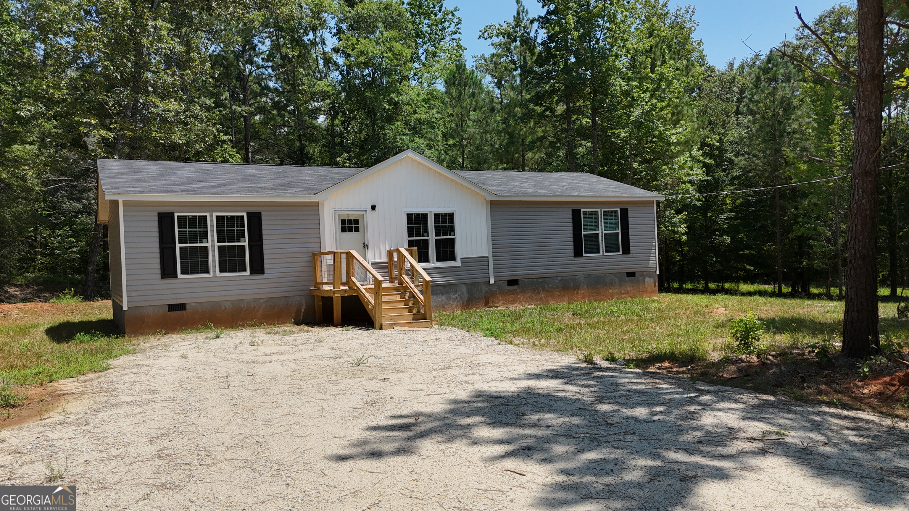 2126 Amberly Road Elberton, GA 30635 - Photo 63 of 68 a view of a house with backyard and trees in the background