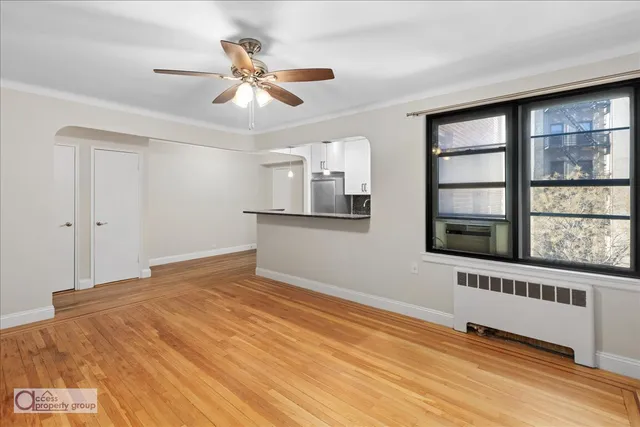 a view of an empty room with a window