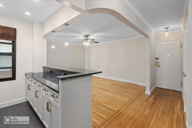 a kitchen with a sink and a stove top oven