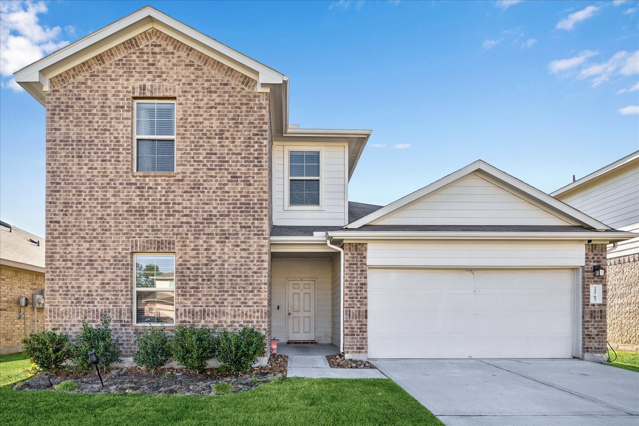 23703 Harrow Field Ln Spring Spring, TX 77373 - Photo 1 of 9 front view of a house with a yard and garage