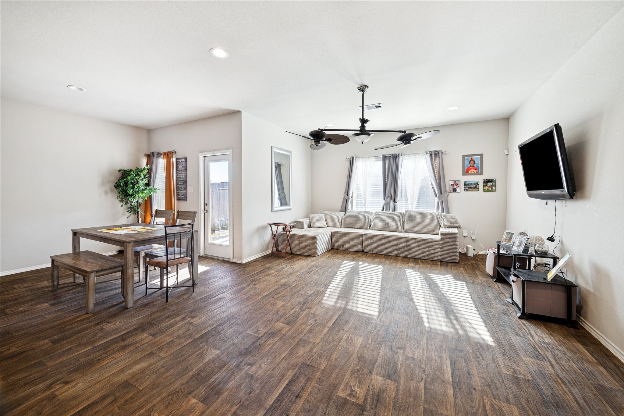 23703 Harrow Field Ln Spring Spring, TX 77373 - Photo 2 of 9 a living room with furniture and a flat screen tv