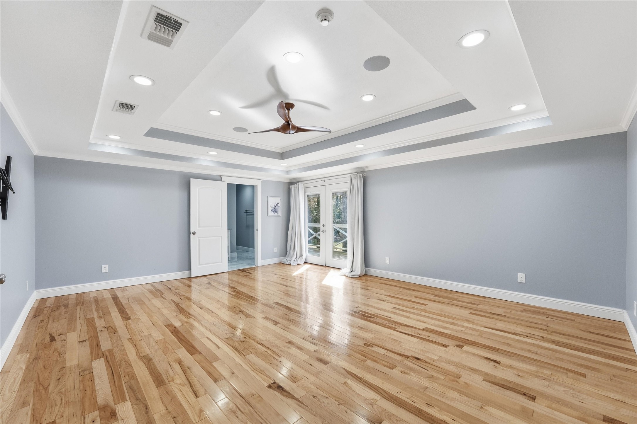 2920 Superior Road Magnolia, TX 77354 - Photo 16 of 46 a view of an empty room with wooden floor and a window