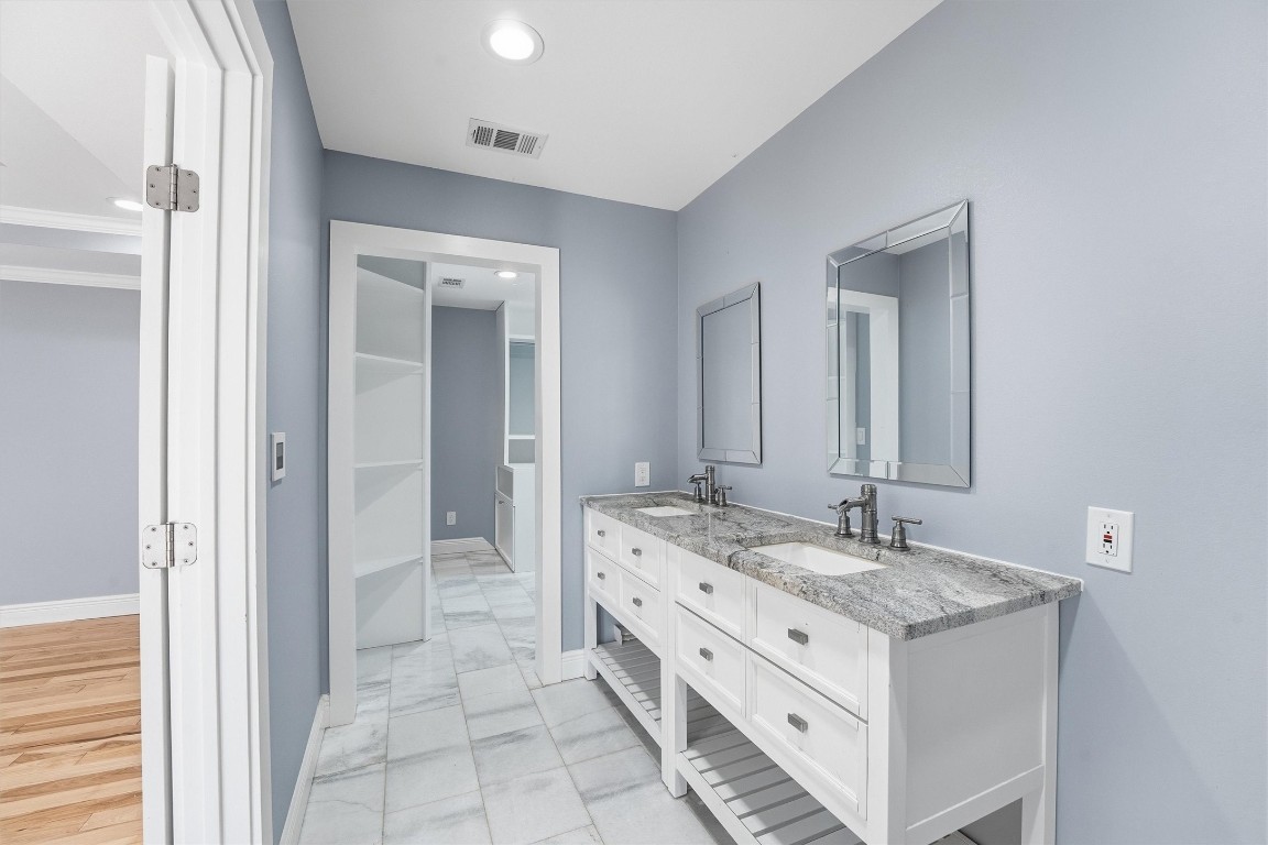 2920 Superior Road Magnolia, TX 77354 - Photo 18 of 46 a bathroom with a double vanity sink and a mirror
