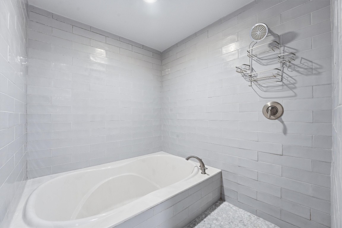 2920 Superior Road Magnolia, TX 77354 - Photo 19 of 46 a bathroom with a bathtub and shower