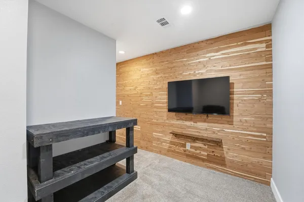 a bathroom with a granite countertop sink a toilet and bathtub