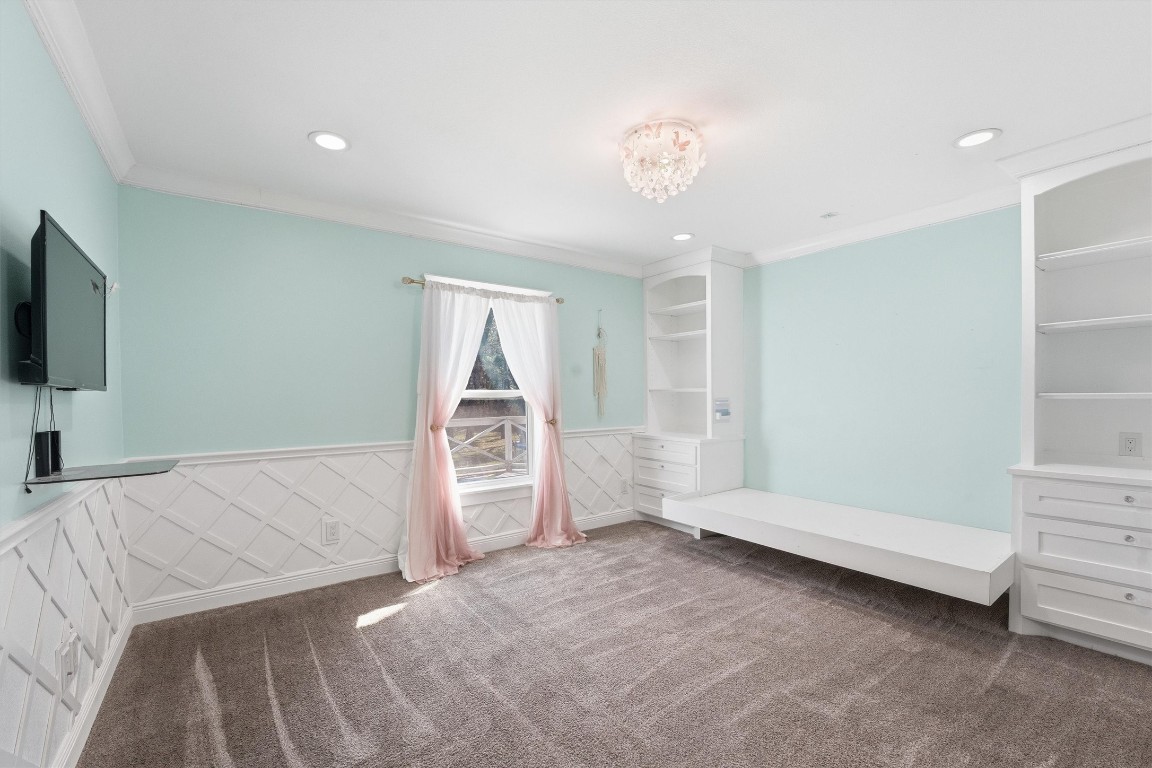 2920 Superior Road Magnolia, TX 77354 - Photo 31 of 46 a spacious bedroom with a bed and a flat screen tv