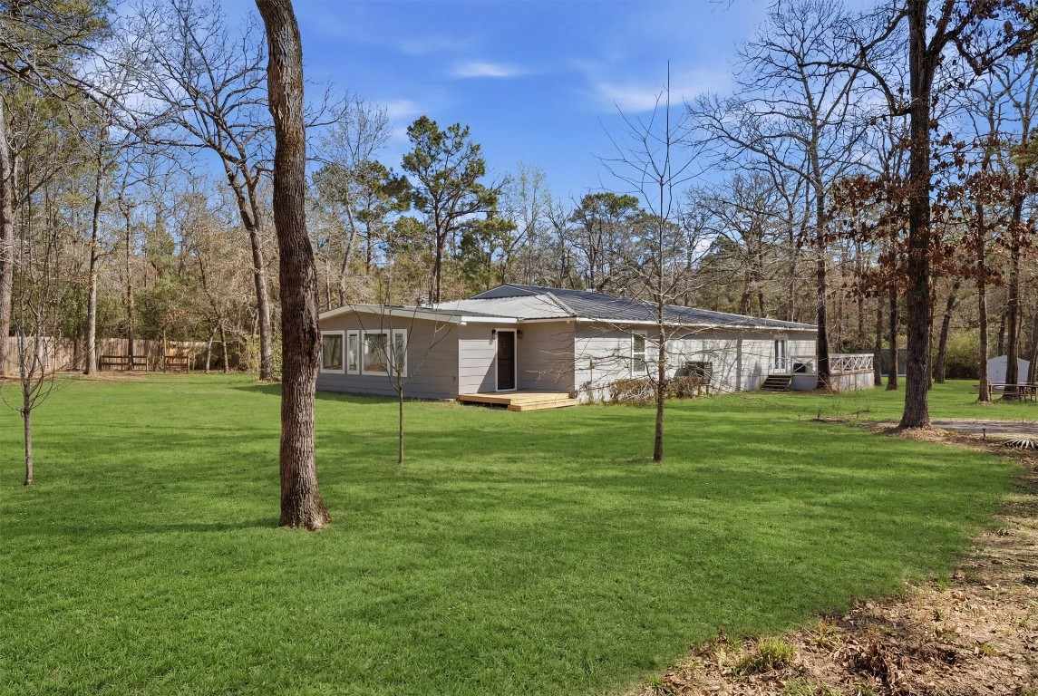 2920 Superior Road Magnolia, TX 77354 - Photo 35 of 46 a house with trees in the background