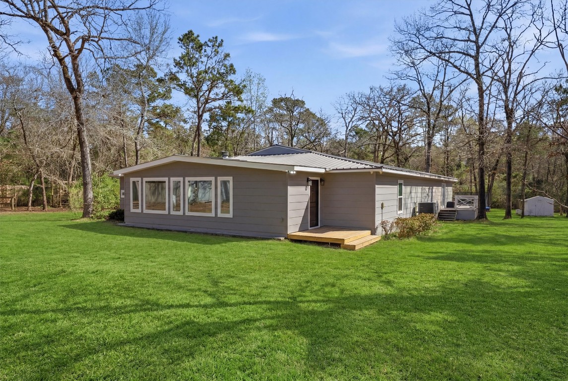 2920 Superior Road Magnolia, TX 77354 - Photo 36 of 46 a view of a house with a yard