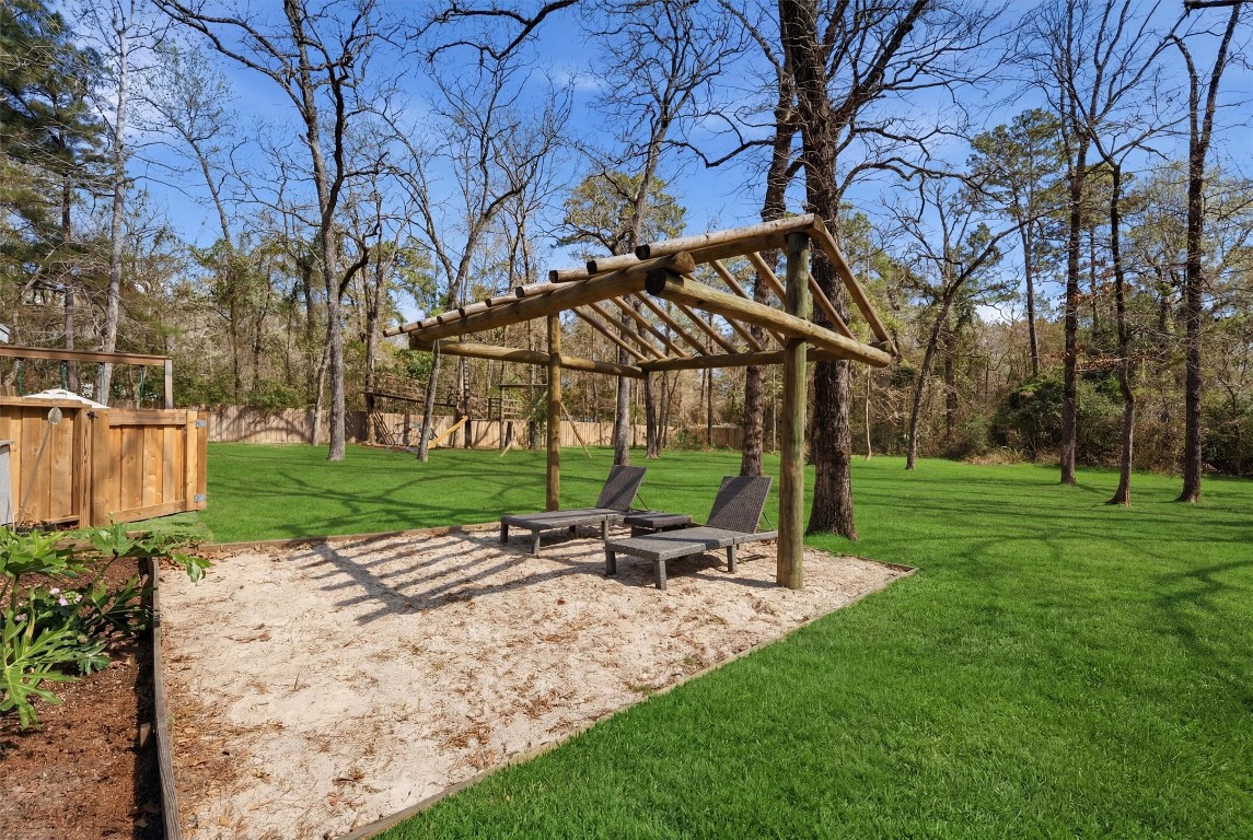 2920 Superior Road Magnolia, TX 77354 - Photo 39 of 46 a backyard of a house with lots of green space