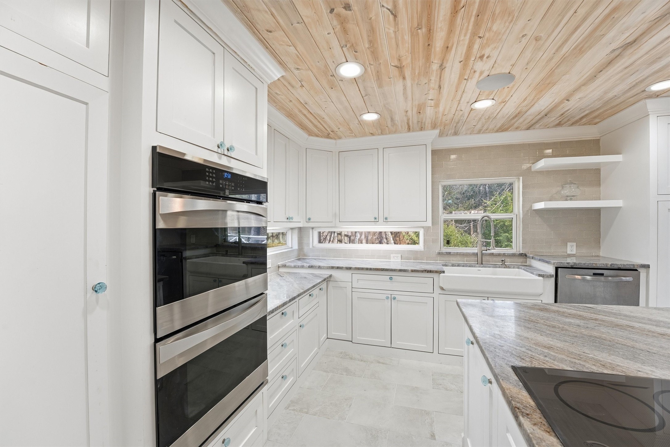 2920 Superior Road Magnolia, TX 77354 - Photo 5 of 46 a kitchen with stainless steel appliances granite countertop a stove a sink and a refrigerator